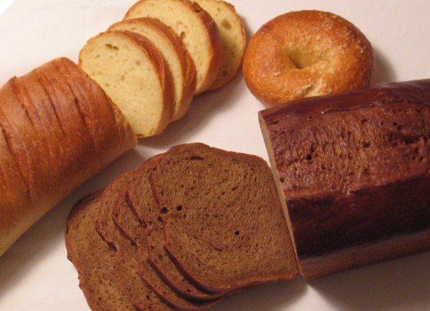 sliced loaves of bread and bagels