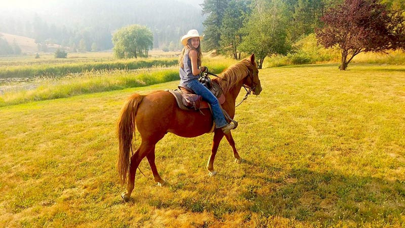Rachel riding a horse