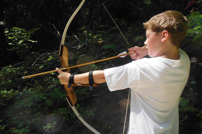 young man drawing an arrow