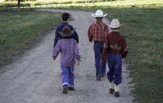 four cousins walking the ranch trail