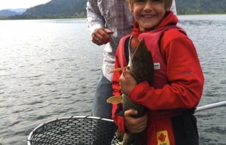 child holding a fish