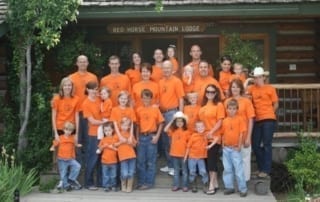 family reunion group photo with orange shirts