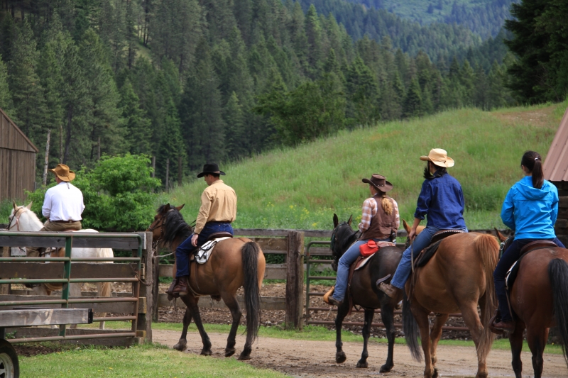 Group leaving the ranch on horseback.