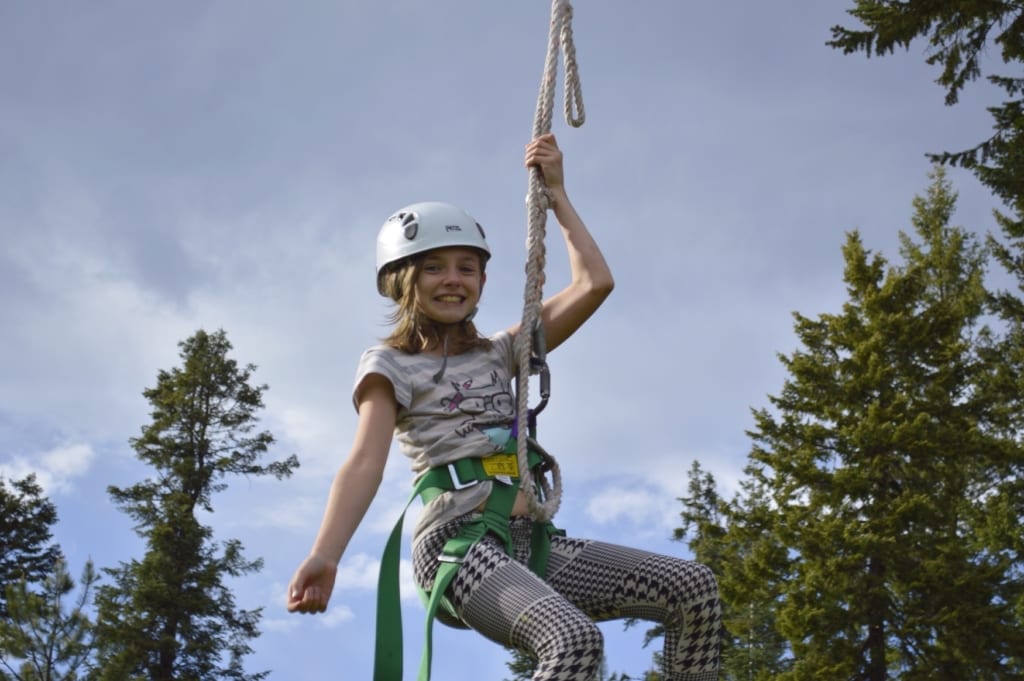 Young woman on zipline.