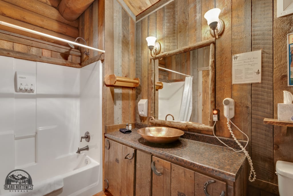 Old Post cabin bathroom with shower/tub.