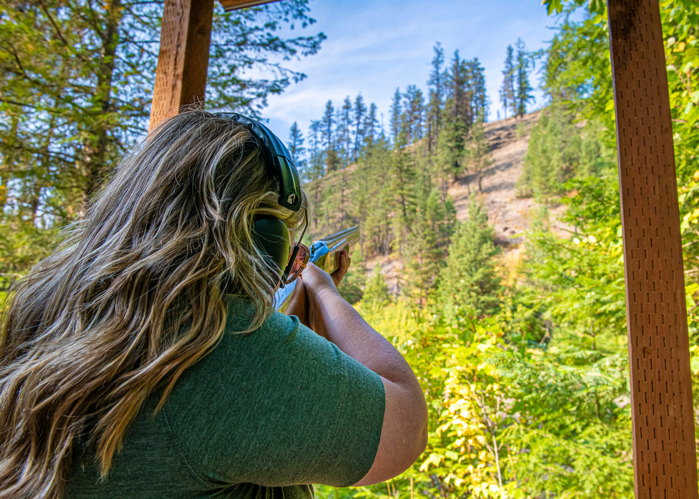 A young outdoor enthusiast tries her hand at sporting clay shooting at Red Horse Mountain Ranch.