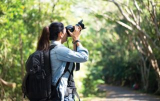 A ranch guest takes pictures during a self-guided photography tour near Red Horse Mountain Ranch.