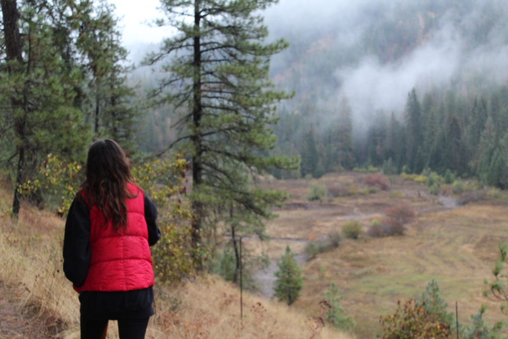A woman hiking during an adult-only all-inclusive dude ranch resort vacation.